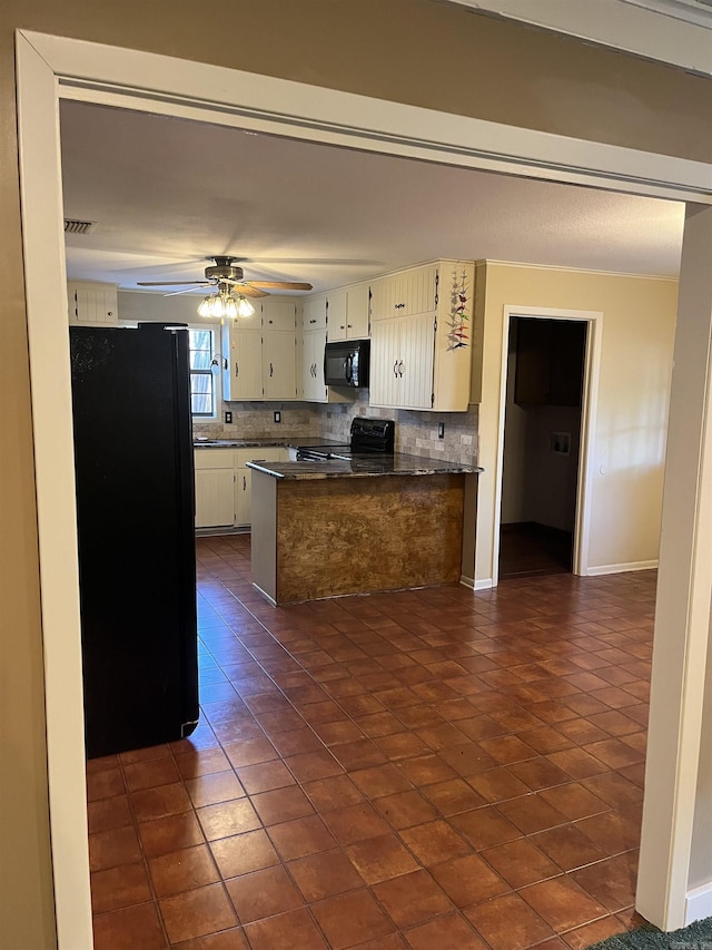 kitchen with black appliances, ceiling fan, dark tile patterned floors, white cabinetry, and kitchen peninsula