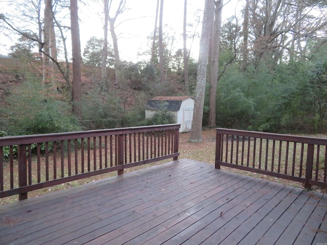 wooden terrace featuring a shed