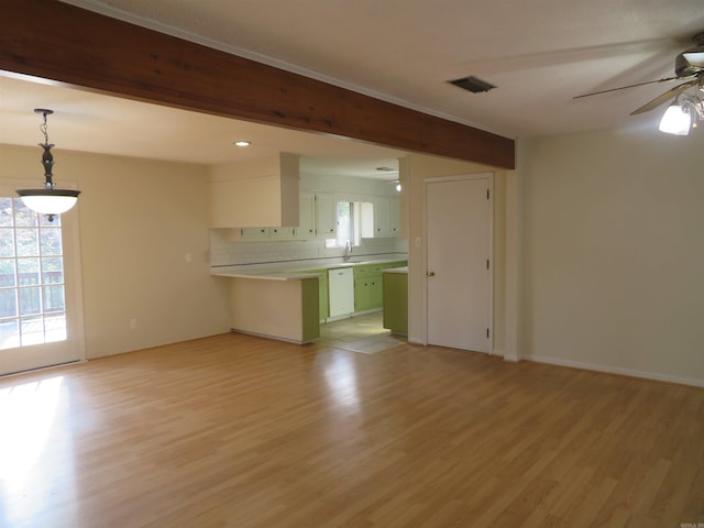 unfurnished living room featuring ceiling fan, beam ceiling, and light wood-type flooring