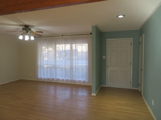 foyer with ceiling fan and light hardwood / wood-style floors