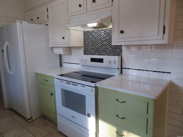 kitchen featuring white cabinetry, backsplash, light tile patterned floors, green cabinetry, and white appliances