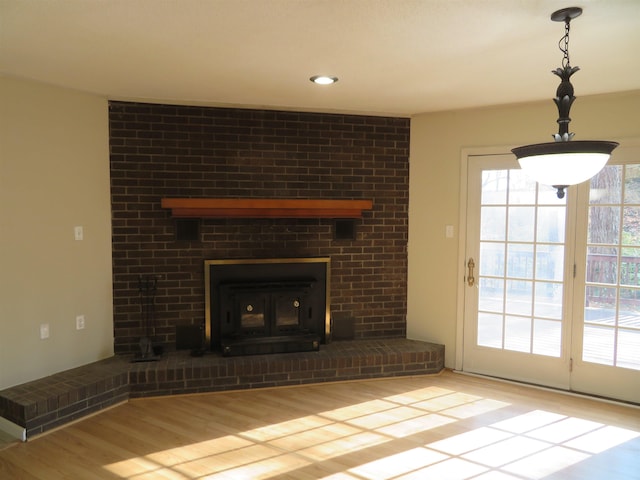 unfurnished living room with light hardwood / wood-style flooring