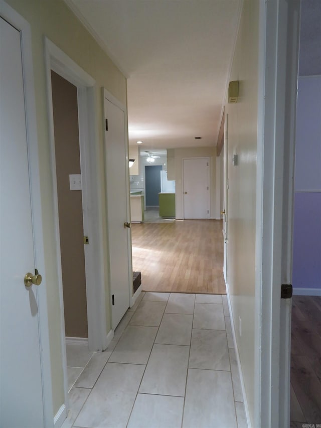 corridor with light tile patterned floors