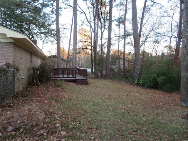 view of yard featuring a wooden deck