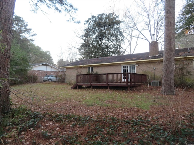 back of property featuring a deck and central air condition unit