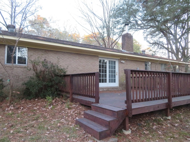 back of house with a deck