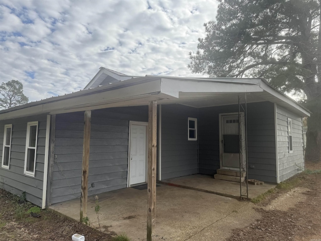 exterior space featuring a carport