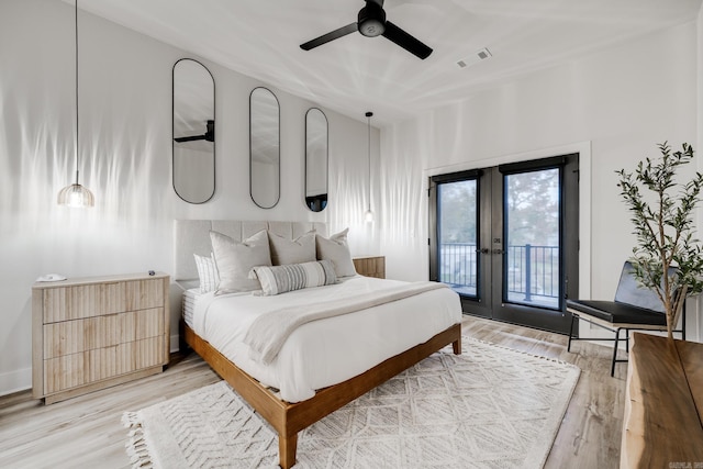 bedroom with french doors, access to outside, ceiling fan, and light hardwood / wood-style floors