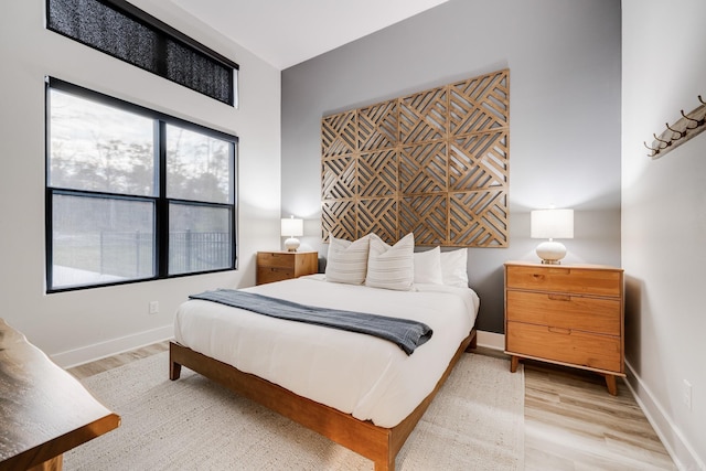 bedroom with light wood-type flooring