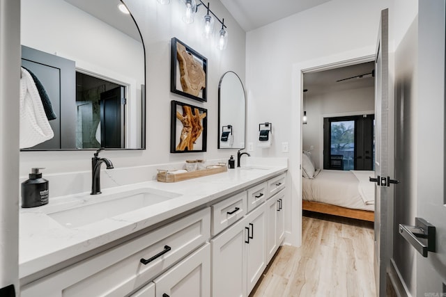 bathroom featuring hardwood / wood-style floors and vanity