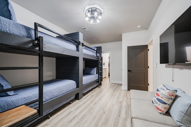 bedroom with light hardwood / wood-style floors