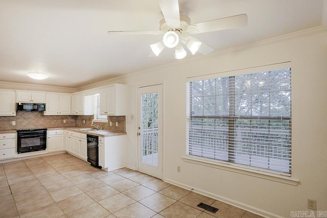 kitchen featuring decorative backsplash, ornamental molding, black appliances, light tile patterned floors, and white cabinetry