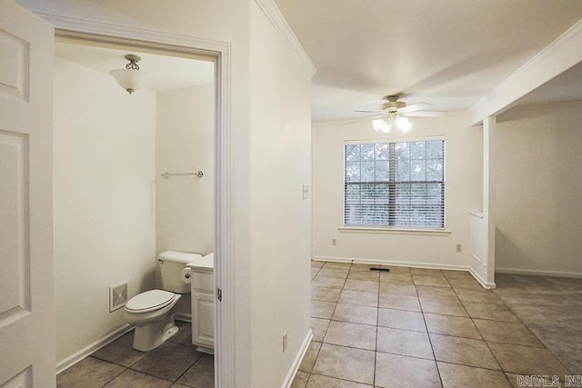 bathroom with tile patterned flooring, toilet, ceiling fan, and crown molding