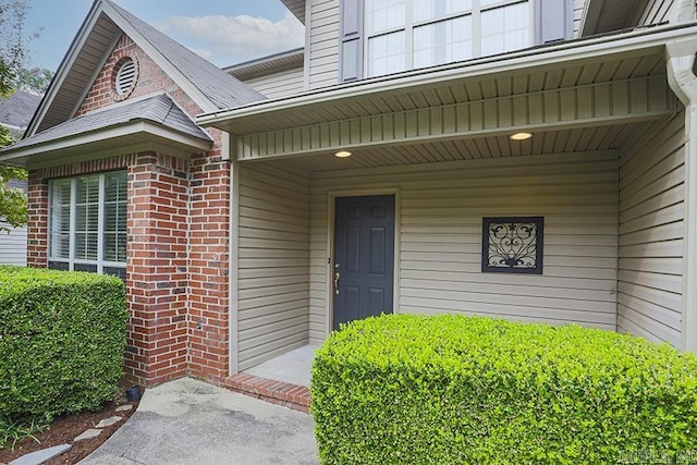 doorway to property with a porch