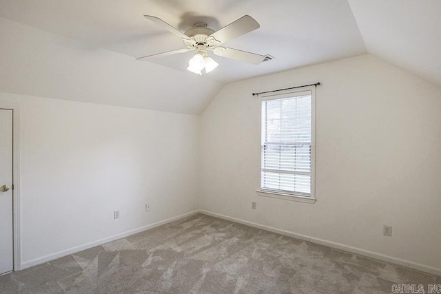 bonus room featuring ceiling fan, light colored carpet, and vaulted ceiling