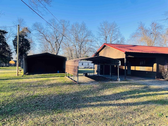 exterior space with a yard and a carport