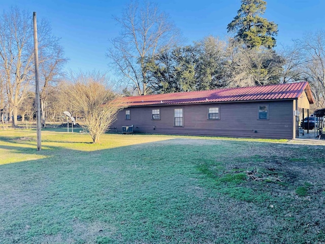 rear view of house with a yard