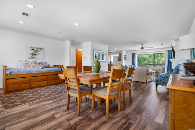 dining area featuring ceiling fan and dark hardwood / wood-style floors