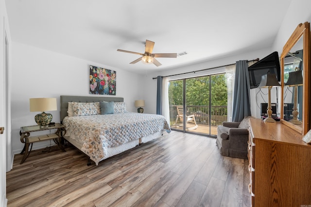 bedroom with access to exterior, ceiling fan, and wood-type flooring