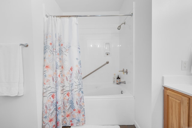 bathroom with vanity and shower / tub combo