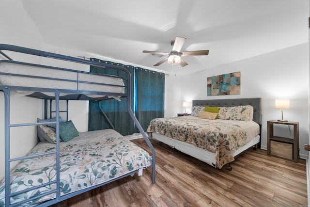 bedroom featuring ceiling fan and wood-type flooring