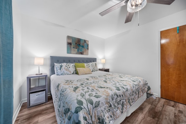 bedroom featuring ceiling fan and dark hardwood / wood-style floors