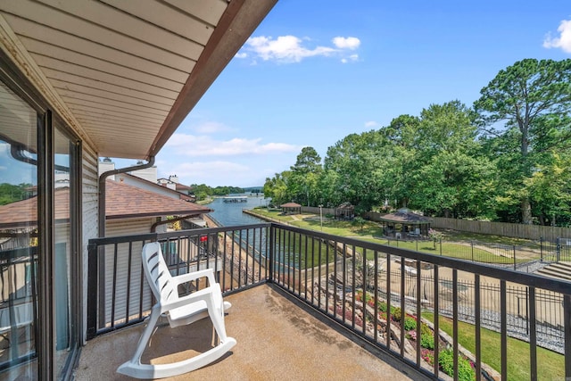 balcony featuring a water view