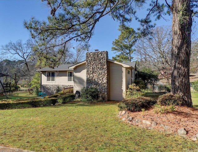 view of property exterior with a lawn