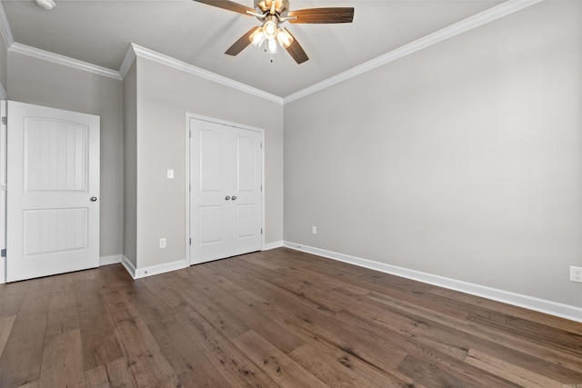 unfurnished bedroom with dark hardwood / wood-style floors, ceiling fan, and crown molding