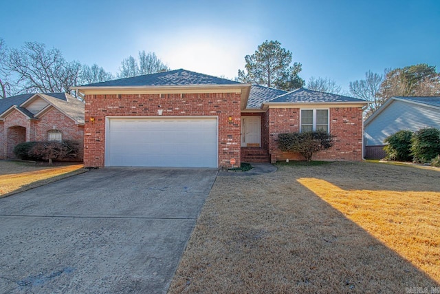 single story home with a front lawn and a garage