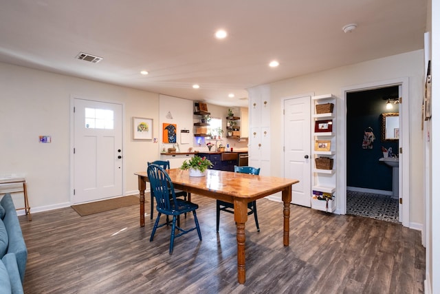 dining room featuring dark hardwood / wood-style flooring