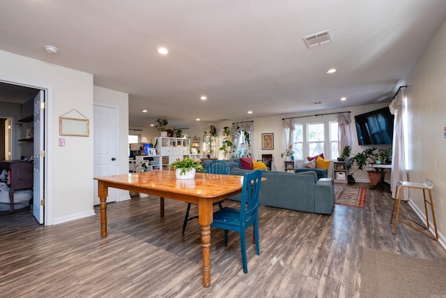 dining area with hardwood / wood-style flooring