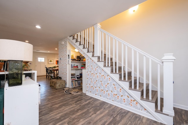 stairs featuring wood-type flooring