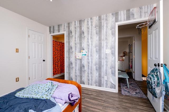 bedroom featuring dark wood-type flooring