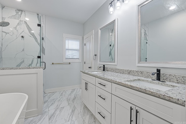 bathroom featuring vanity and shower with separate bathtub