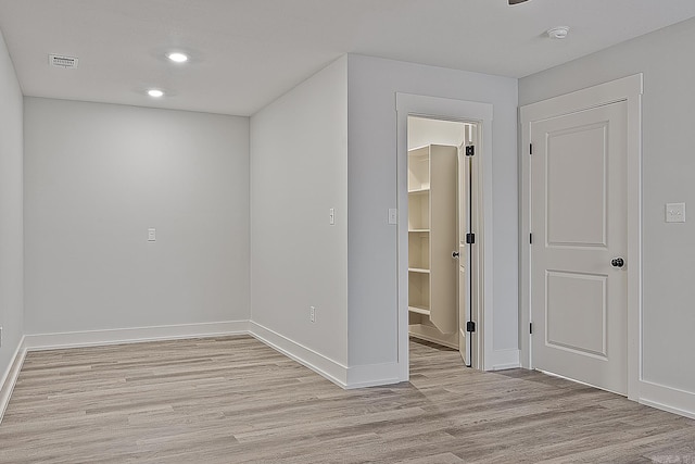 spare room with light hardwood / wood-style floors