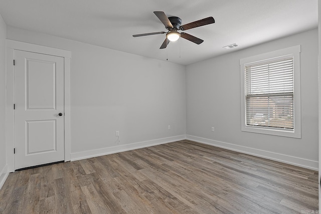 unfurnished room with ceiling fan and light hardwood / wood-style flooring