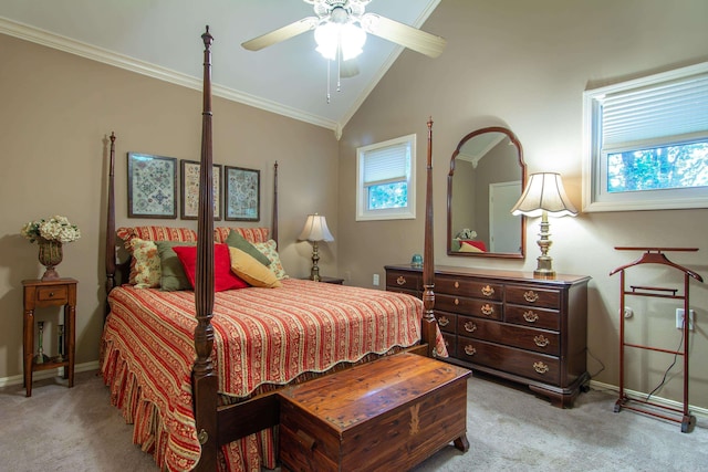 carpeted bedroom with ceiling fan, crown molding, and vaulted ceiling