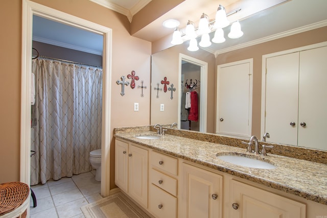 bathroom with toilet, vanity, tile patterned floors, and crown molding