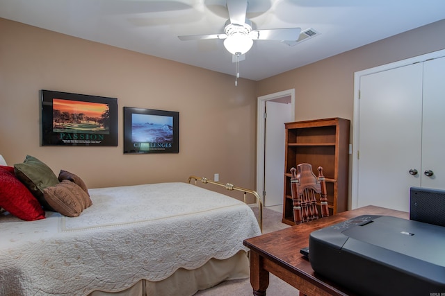 carpeted bedroom with a closet and ceiling fan