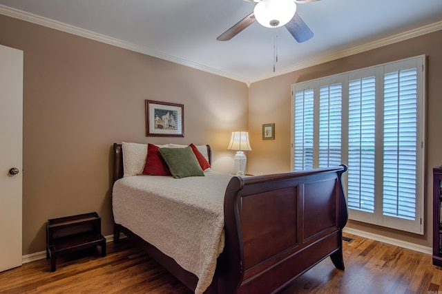 bedroom with hardwood / wood-style flooring, ceiling fan, and ornamental molding