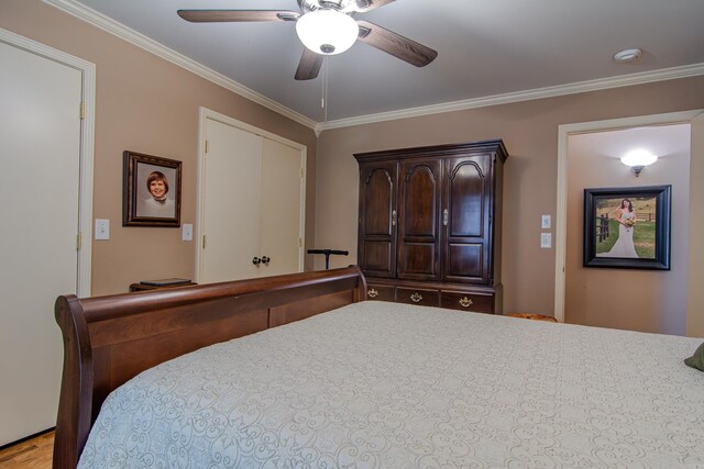 bedroom with ceiling fan and crown molding