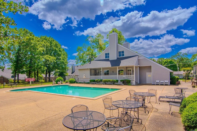 view of swimming pool with a patio