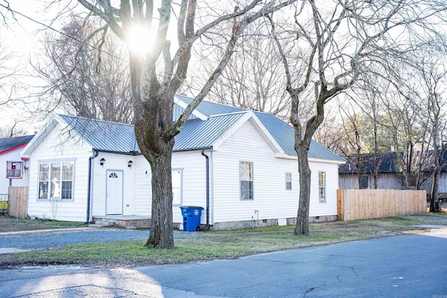 view of property exterior with a yard