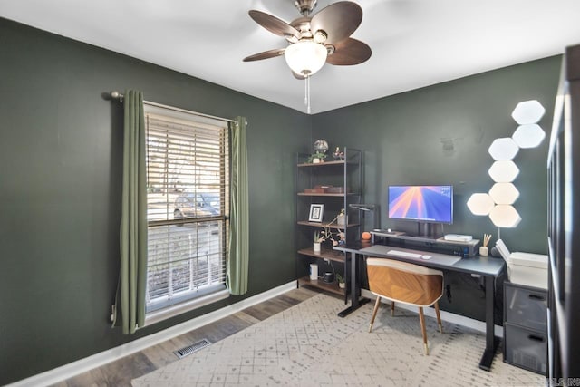 office featuring wood-type flooring and ceiling fan