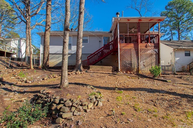 rear view of house featuring a deck