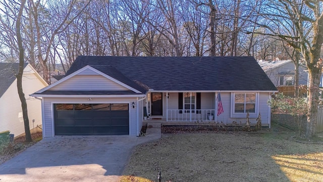 view of front of home with covered porch, a garage, and a front lawn