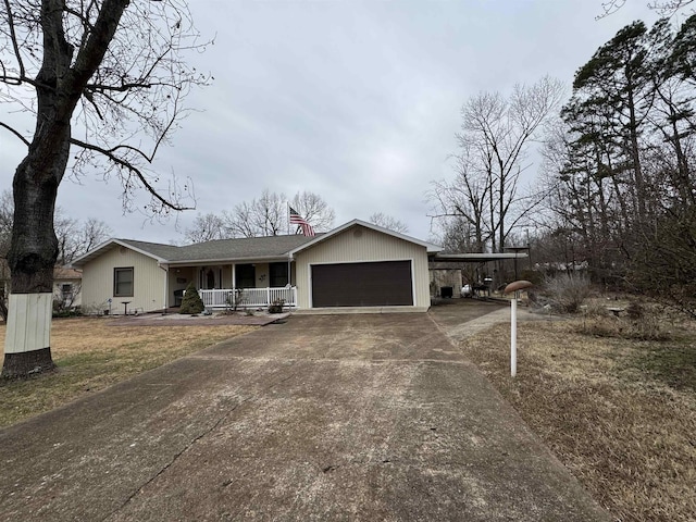 ranch-style house with a front yard, a porch, and a carport