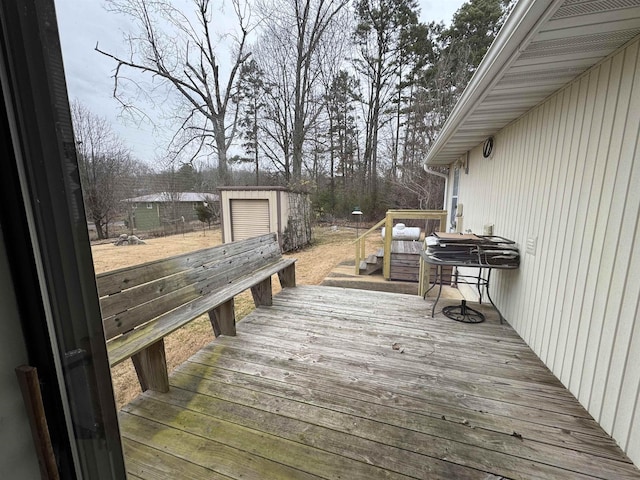 wooden terrace with an outbuilding