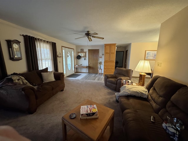 living room featuring carpet and ceiling fan